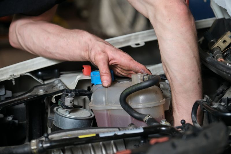Nissan Technician working on an engine