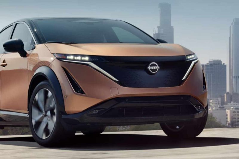 A 2024 Nissan Ariya EV in a rust orange colour
