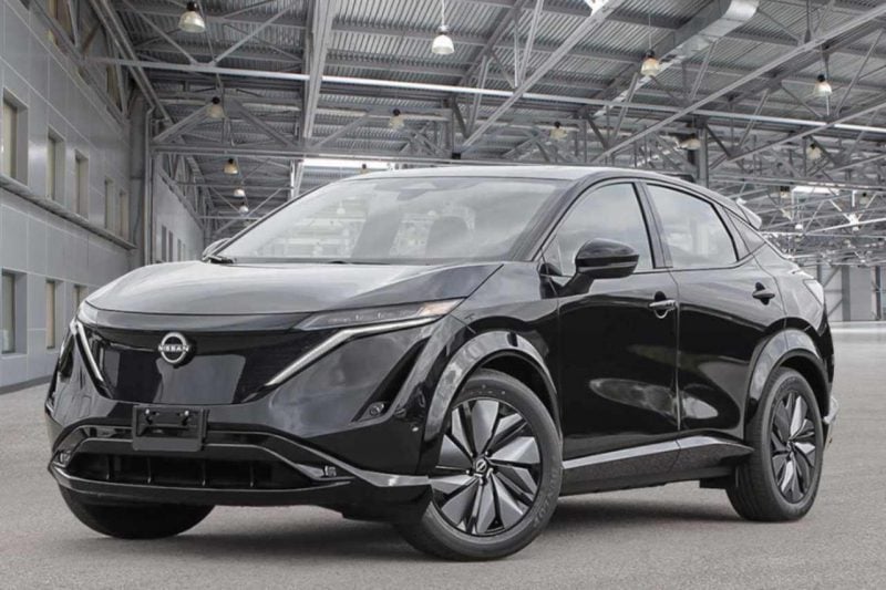 A black 2023 Nissan Ariya as shown in a Nissan showroom.