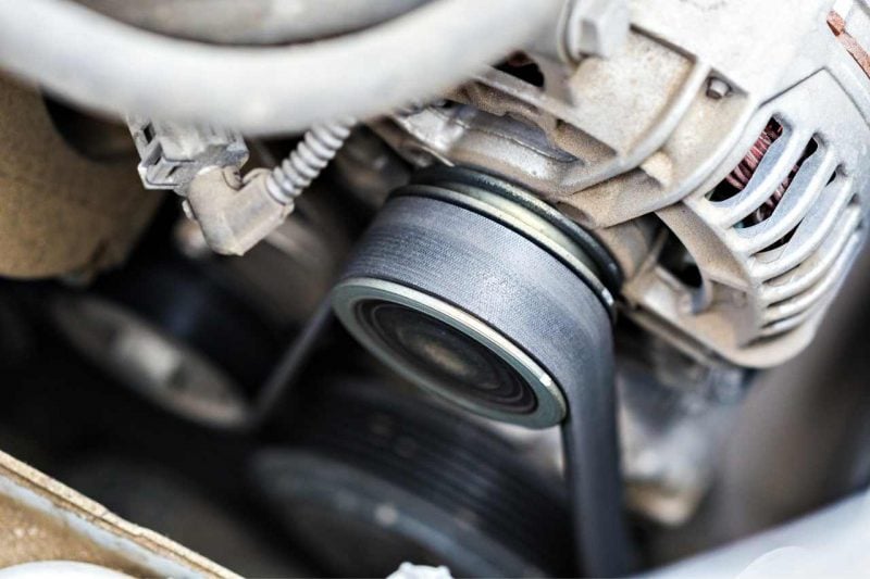 The serpentine belt in a car's engine.