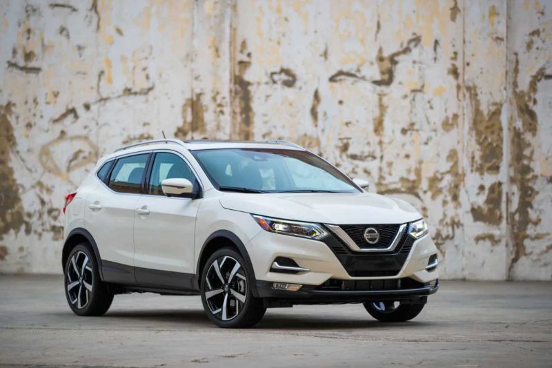 A 2023 Nissan Qashqai in white, parked on a concrete road.