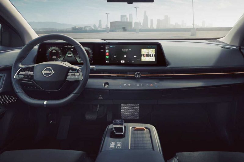 The interior cabin of the 2024 Nissan Ariya, showcasing the new infotainment system and upgrades.