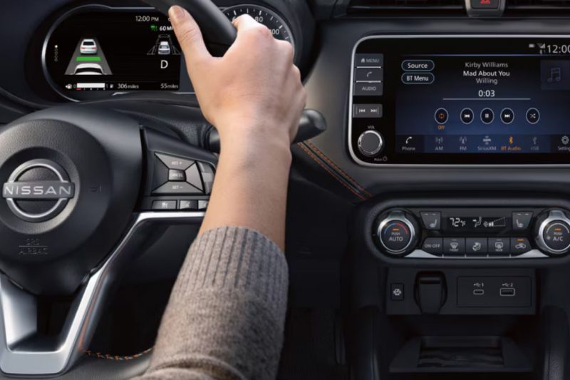 A close-up of the multimedia display and steering wheel of the new Nissan Versa sedan.