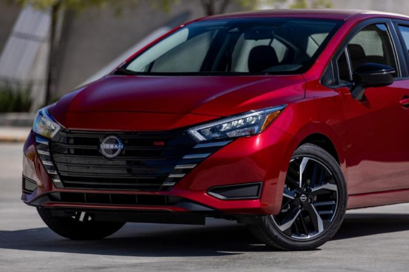 The new 2025 Nissan Versa compact sedan in the colour Scarlet Ember Tintcoat (red).