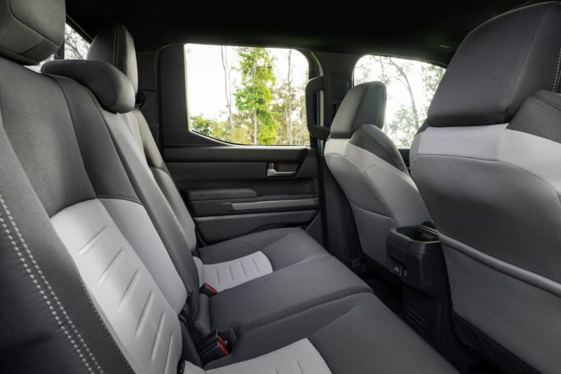The interior of the Toyota Tacoma cabin, showcasing grey seats and two-row seating.