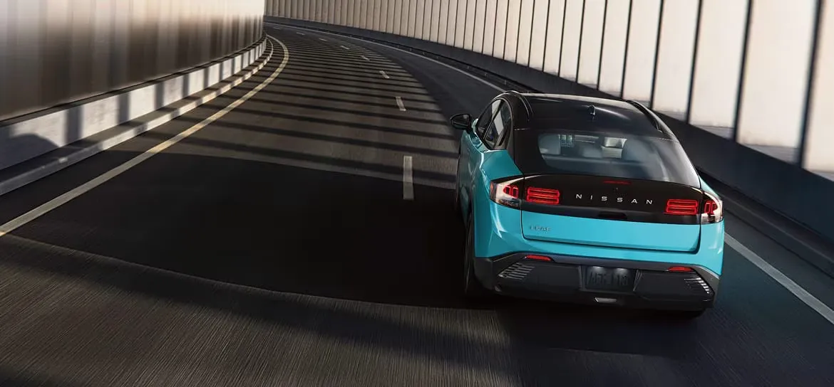 2026 Nissan Leaf electric driving through a tunnel.