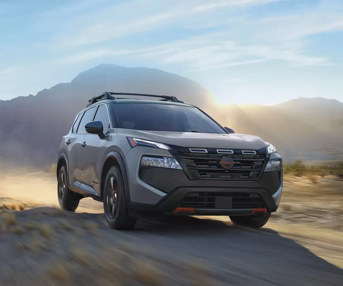 Gasoline 2026 Nissan Rogue driving off-road to present its performance.