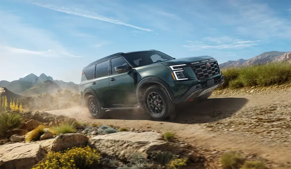 2026 Nissan Armada PRO-4X driving on an off-road trail.