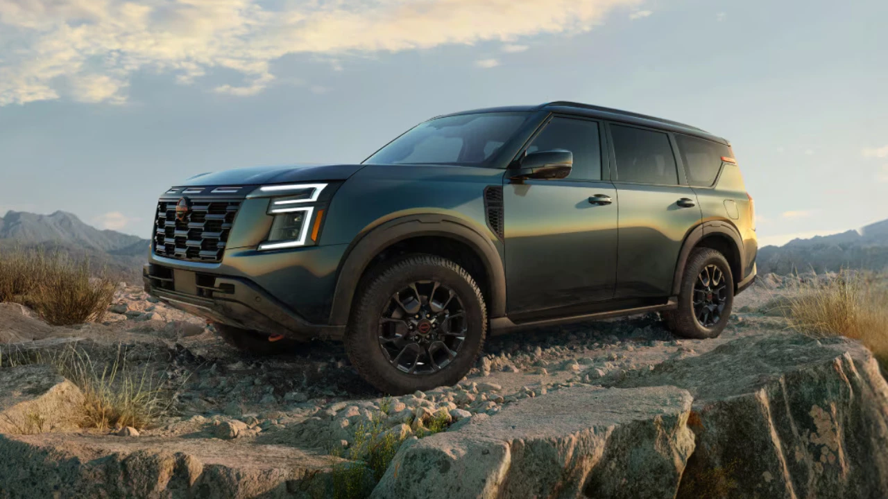 Green 2026 Nissan Armada shown on rocky terrain in the mountains.