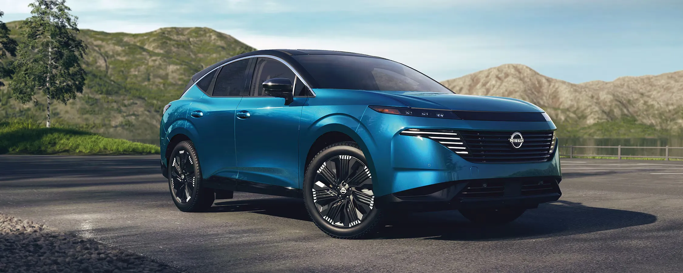 Blue 2026 Nissan Murano with mountains in the background.
