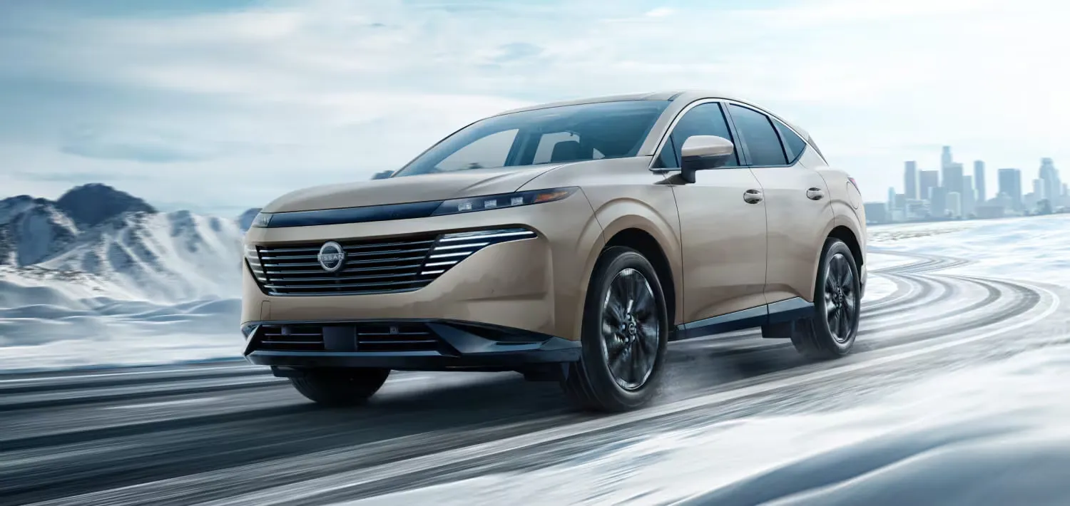 2026 Nissan Murano with all-wheel drive driving on a snowy road.