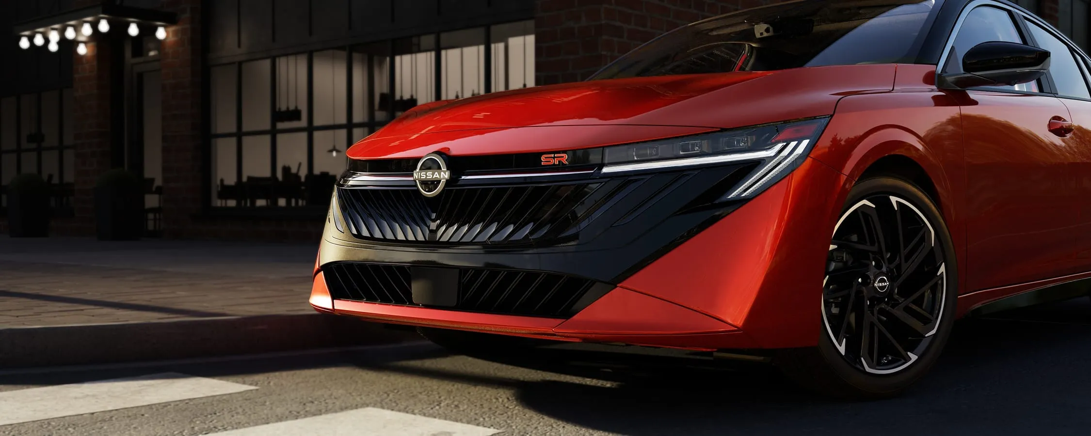 Vue avant de la Nissan Sentra SR 2026 rouge illustrant ses dimensions.