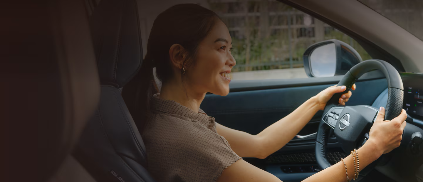 A New Grad Driving A Nissan Vehicle