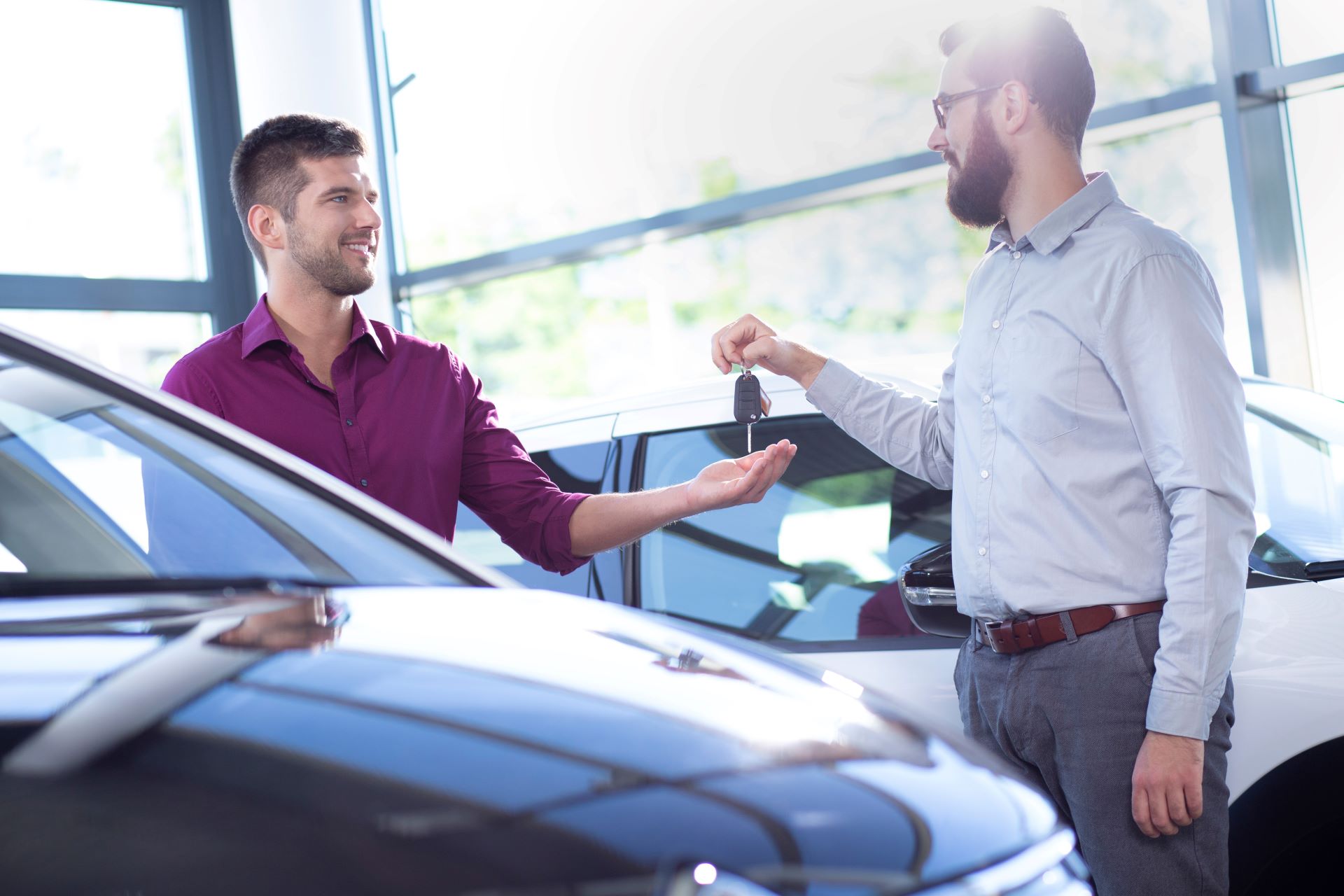 Used car delivery between our customer and our product adviso at Sunridge Auto on a financed used auto